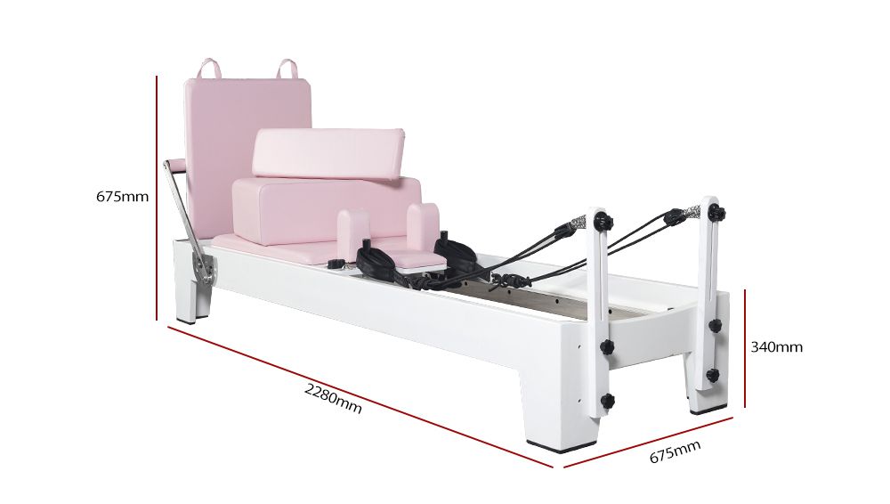 Wit geschilderde eiken roze pilatesapparatuur