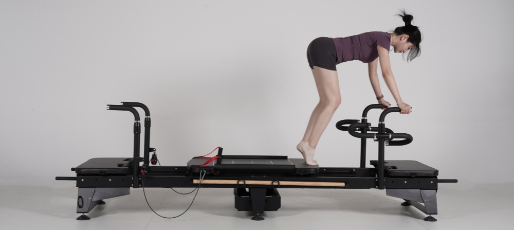 Pilates Reformer Machine met roterende handgrepen